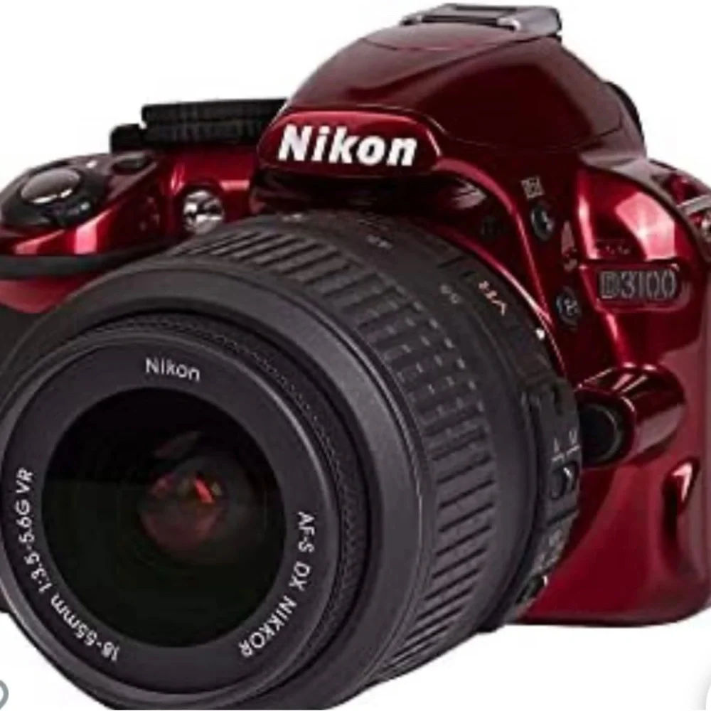 Nikon D3100 new camera has 2 batteries charger extra lens and carrying case